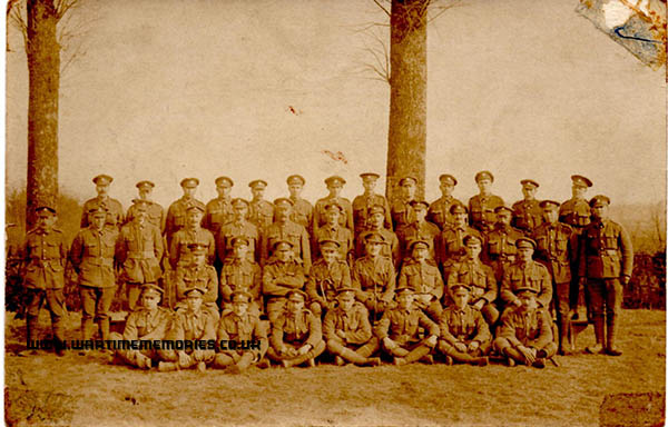 <p>7th Royal Sussex Regiment. John Edward Sands in back row in front of tree